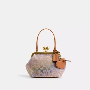 Coach Kisslock Frame Bag 16
In Crystal Signature Jacquard